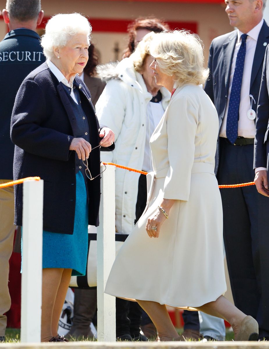 <p>Camilla dips into a curtsy before her mother-in-law, Queen Elizabeth.</p>