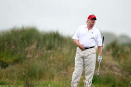 ABERDEEN, SCOTLAND - JULY 10: Donald Trump plays a round of golf after the opening of The Trump International Golf Links Course on July 10, 2012 in Balmedie, Scotland. The controversial £100m course opens to the public on Sunday July 15. Further plans to build hotels and homes on the site have been put on hold until a decision has been made on the building of an offshore windfarm nearby. (Photo by Ian MacNicol/Getty Images)