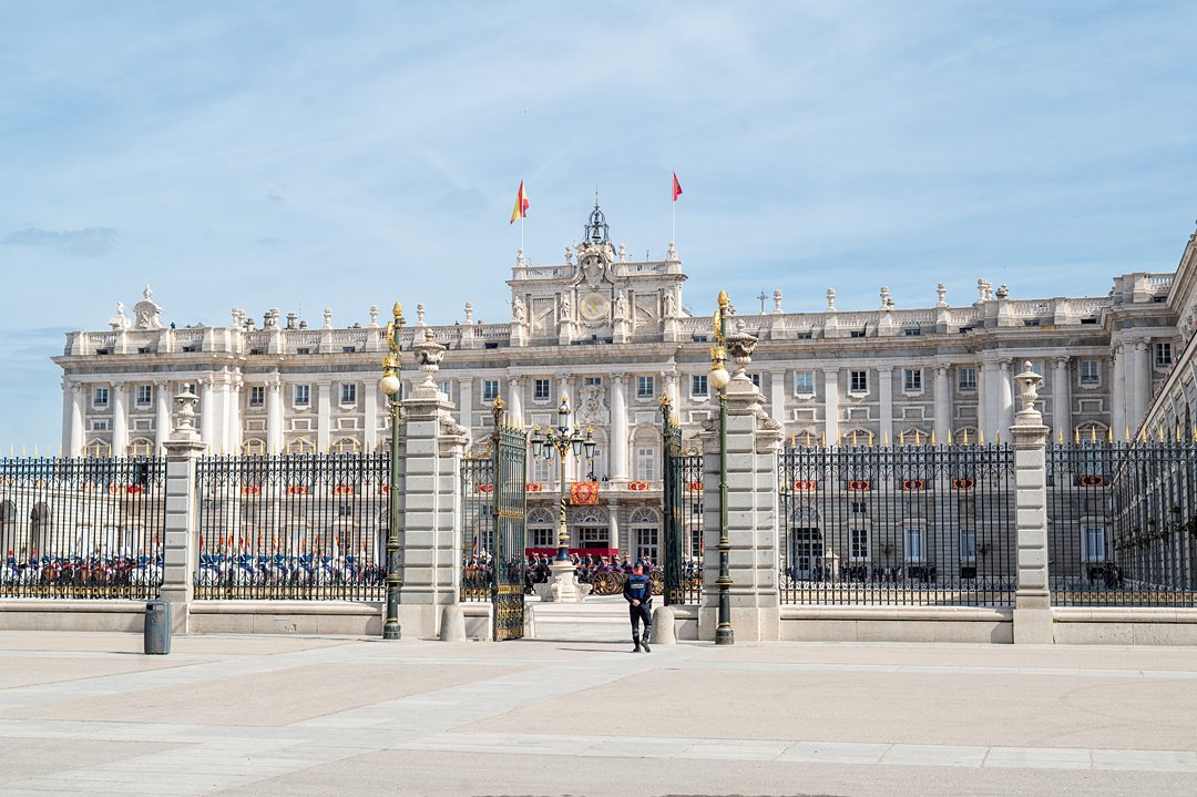 The courtyard of the Palacio de Real Madrid, or Royal Palace of Madrid, is set to receive a Head of State, President of Columbia Gustavo Petro, and First Lady, Verónica Alcocer García. Royal Guard members are in front of the palace, and two flags are raised on top of the building — left is the flag of Spain, and right is the Royal Standard of Spain, The King’s flag.
