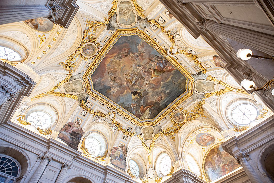 View of the ceiling above the Grand Staircase at the Palacio de Real Madrid. The room design consists of Baroque and Neoclassical elements.