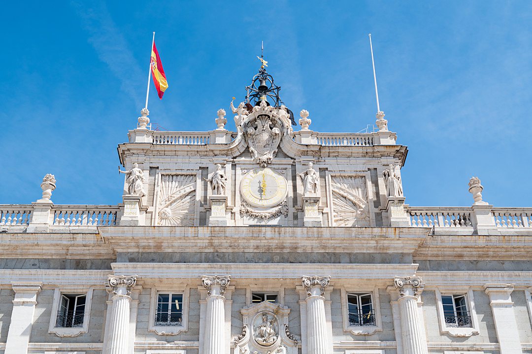 The Spanish flag forever flies above the Royal Palace of Madrid. The flag showing the royal coat of arms (the Royal Standard of Spain, or King’s Flag) is only raised when the King is at the palace. Though it is the official residence of the royal family, they do not live at the palace. Instead, it is used for state ceremonies. It is open to tourists for a ticketed price when not being used for official business.