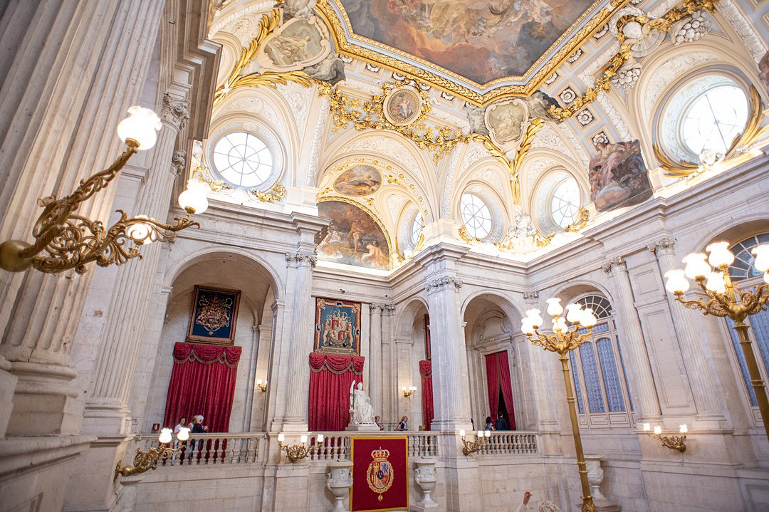 The Grand Staircase of the Royal Palace of Madrid has two flights of stairs made from Spanish marble, totaling 70 steps. It is an opulent room that impresses all who visit. A striking ceiling painting illustrates Spain’s Triumph of Religion and Church.
