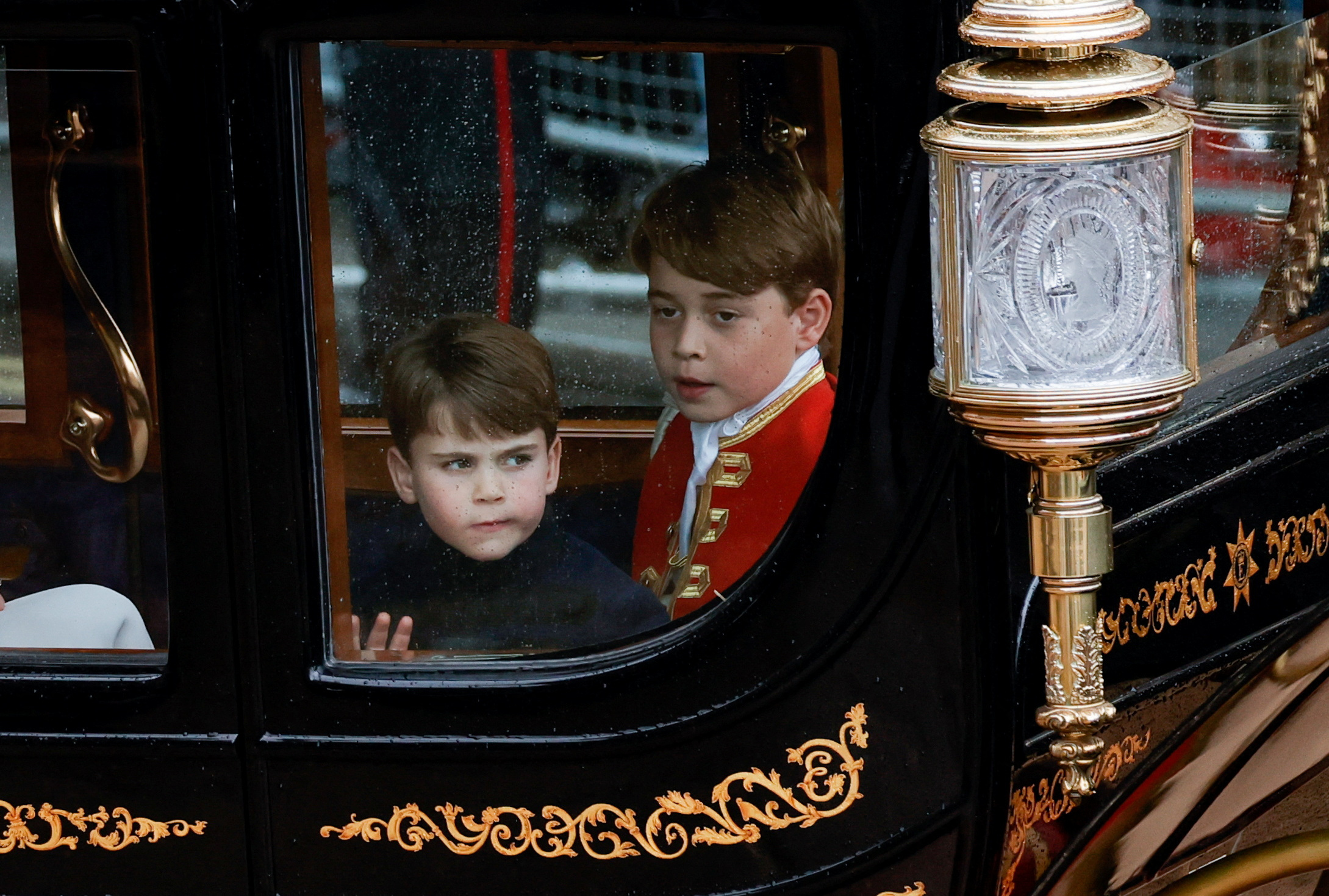 <p>Prince Louis and big brother Prince George traveled towards Buckingham Palace in a coach following <a href="https://www.wonderwall.com/celebrity/the-coronation-of-king-charles-iii-and-queen-camilla-the-best-pictures-of-all-the-royals-at-this-historic-event-735015.gallery">the coronation</a> of King Charles III and Queen Camilla at Westminster Abbey in London on May 6, 2023.</p>