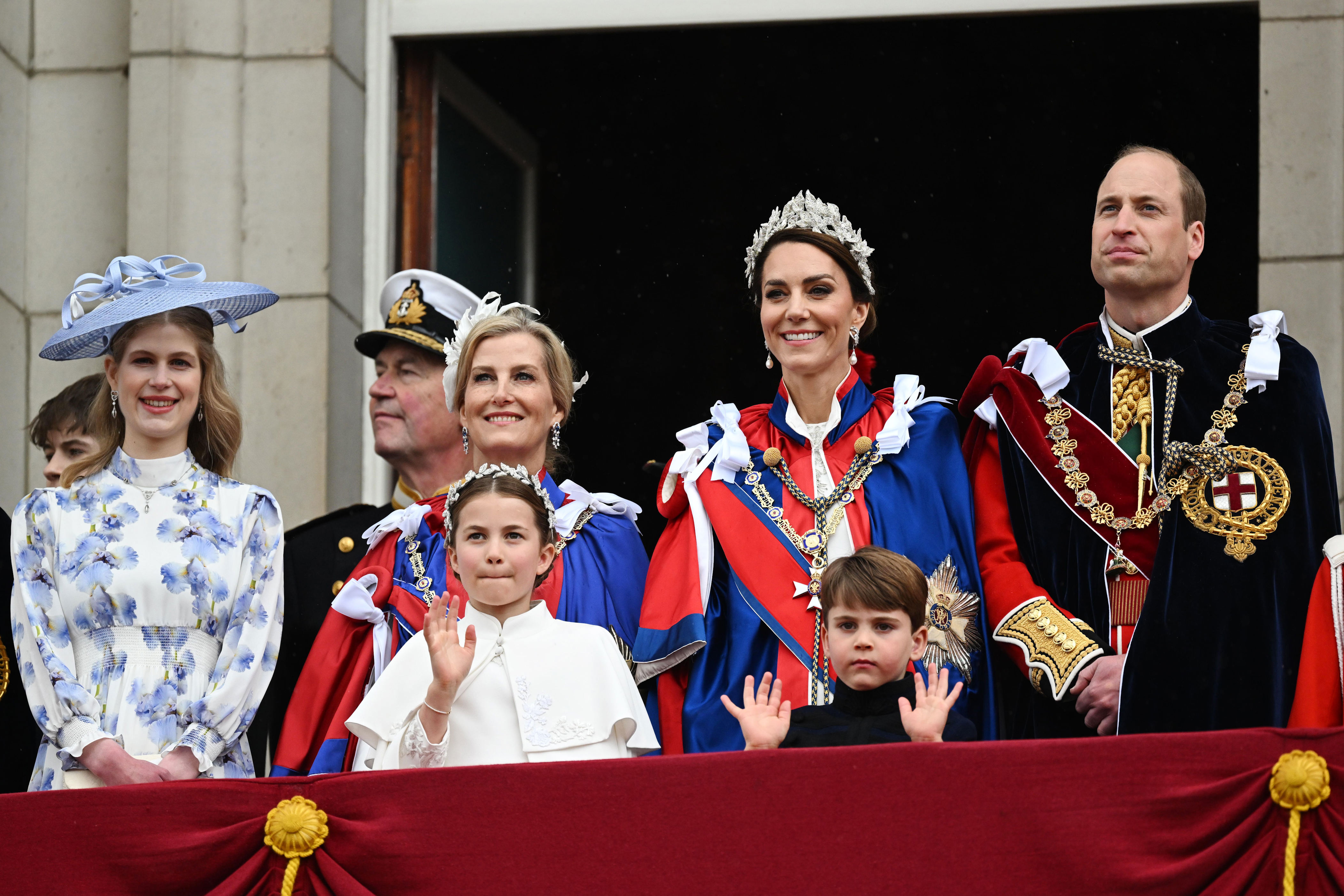 <p>Princess Charlotte waved while little brother Prince Louis raised the roof alongside their parents, Princess Kate and Prince William, on the balcony of Buckingham Palace in London following <a href="https://www.wonderwall.com/celebrity/the-coronation-of-king-charles-iii-and-queen-camilla-the-best-pictures-of-all-the-royals-at-this-historic-event-735015.gallery">the coronation</a> of King Charles III on May 6, 2023.</p>