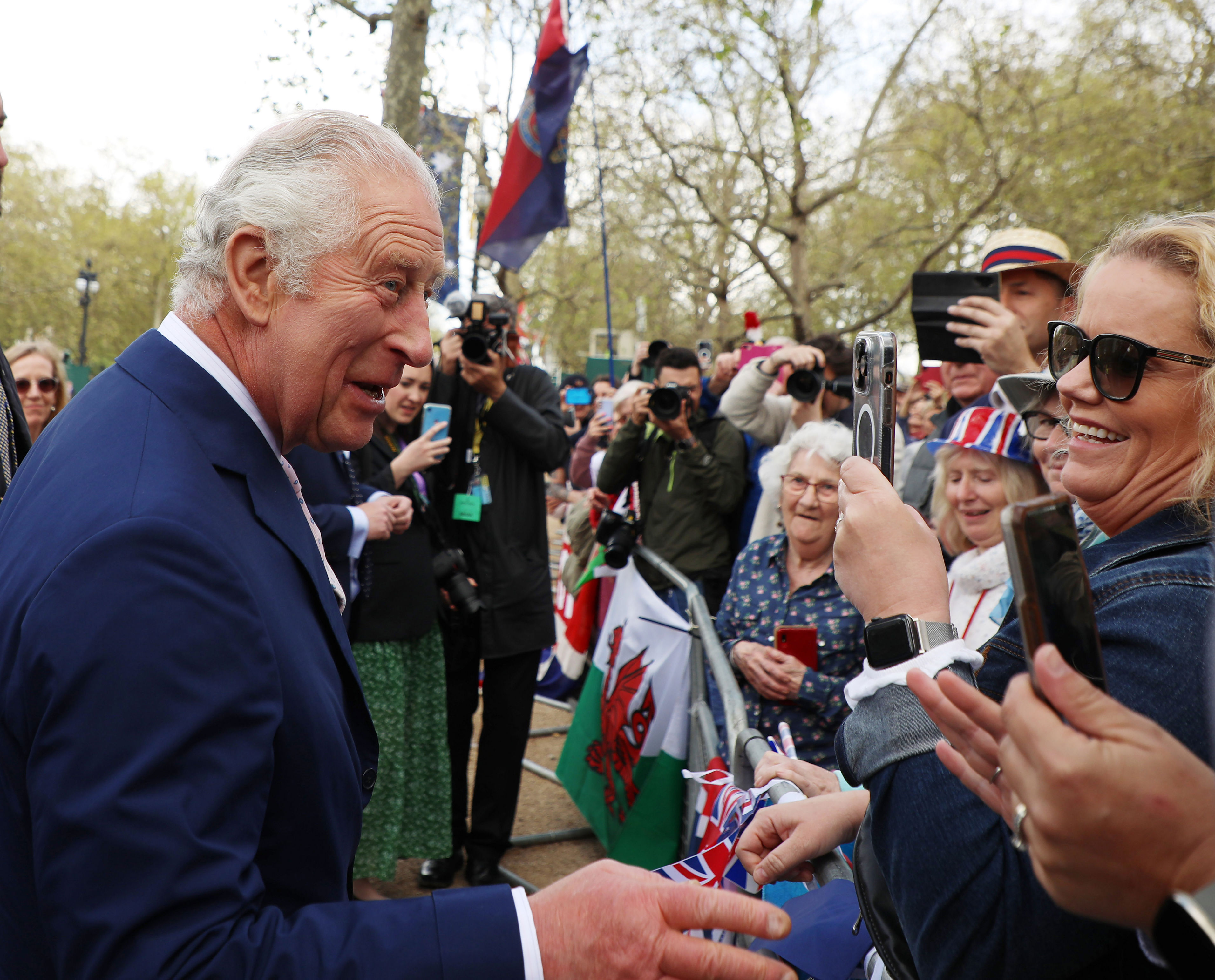 <p>A visibly delighted King Charles III shook hands with members of the public along the Mall in London during an impromptu walkabout on May 5, 2023 -- the day before his coronation.</p>