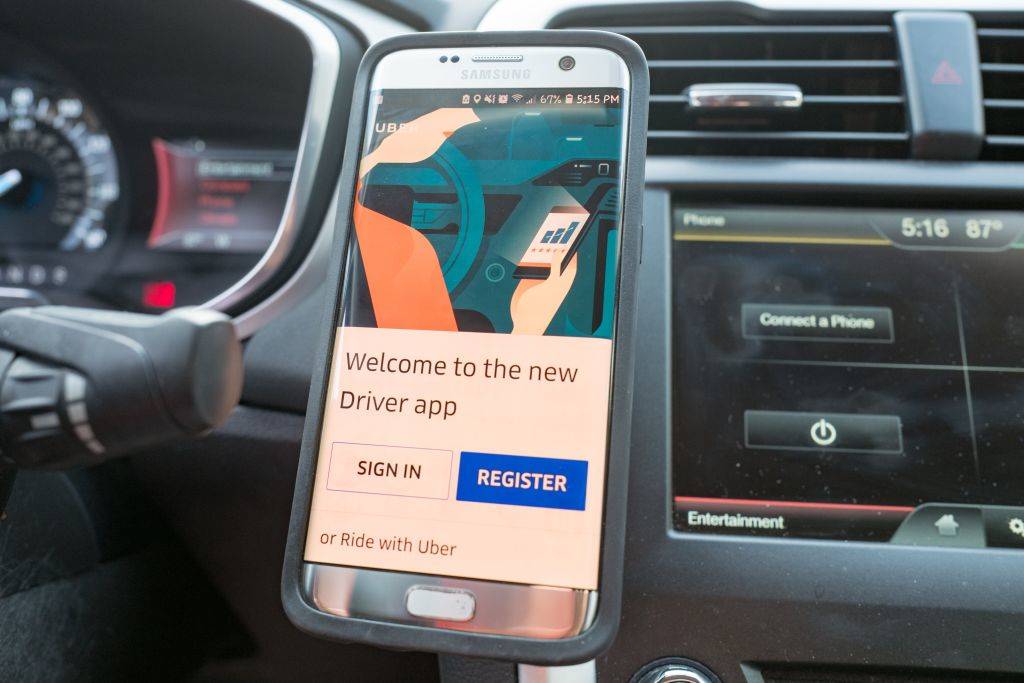 <p>Hands-free access to a smartphone is something that a lot of drivers depend on. While some may buy a mount where they can attach a smartphone to their dashboard, there is a cheaper alternative. All you need is an ordinary rubber band.</p> <p>Simply slip the rubber band around the slots of the vent and wrap it around your phone. It may not be the most stable solution, but will hold your phone in place in order for you to get hands-free directions, talk, look up cheap gas prices, and more.</p>