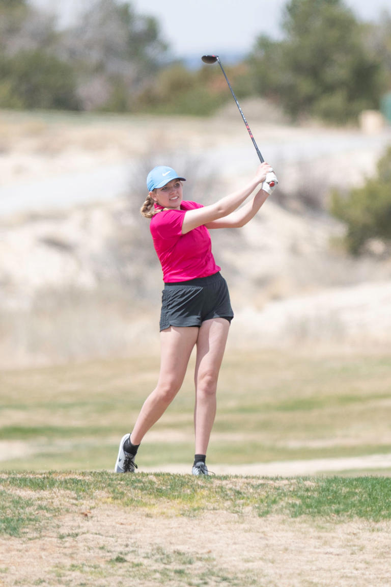 Pueblo West's Clayre Wagner watches her tee shot on the 5th hole during a tournament at Four Mile Ranch Golf Club on Thursday, April 13, 2023.