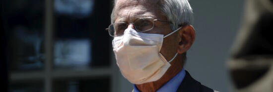 Director of the National Institute of Allergy and Infectious Diseases Dr. Anthony Fauci listens as President Donald Trump speaks about the coronavirus in the Rose Garden of the White House, Friday, May 15, 2020, in Washington. (Alex Brandon/AP)