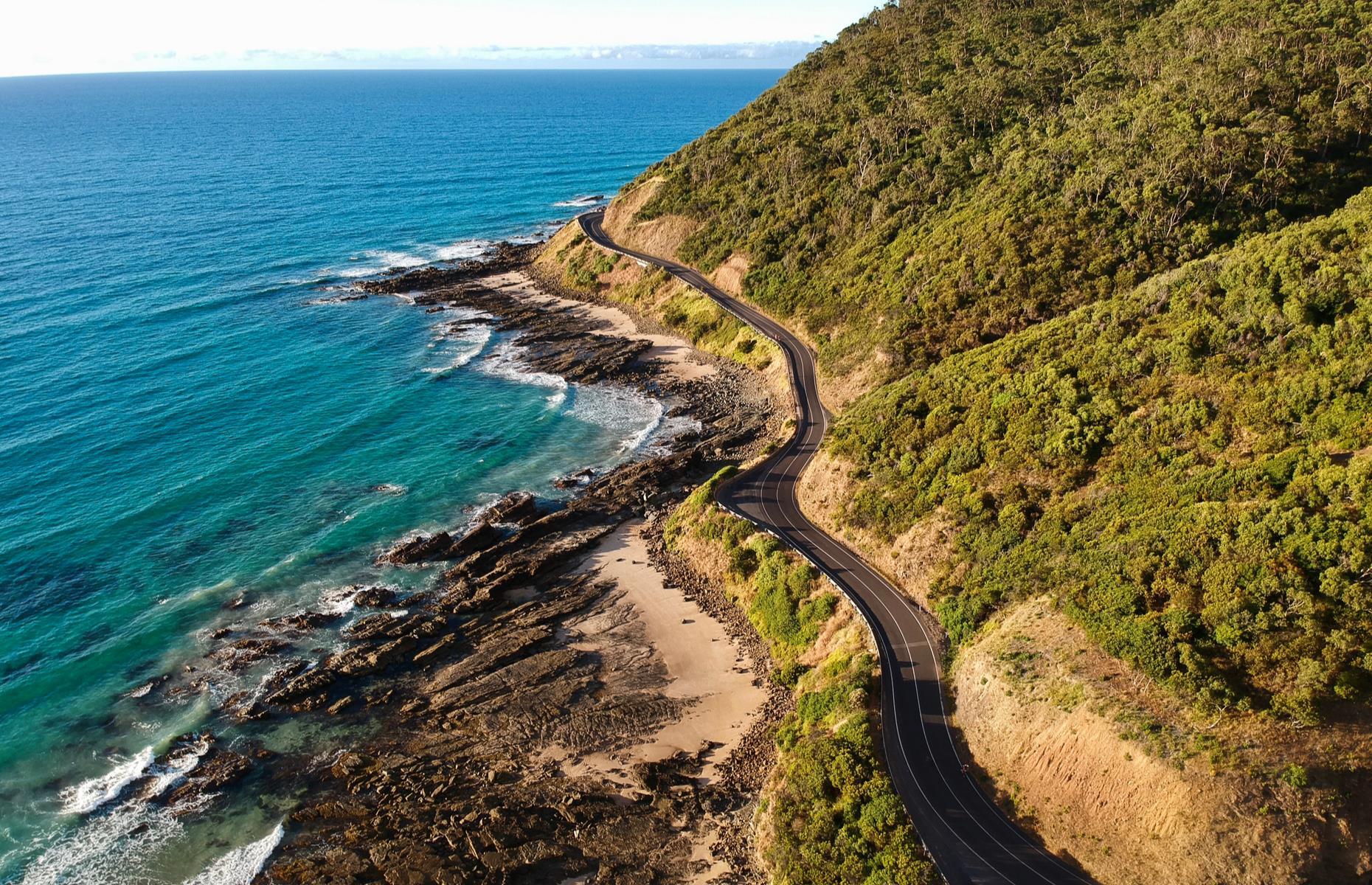Heading off into the horizon on a road trip is an Aussie rite of passage – from cruising along sun-splashed coastal roads to tracking across dead-straight desert highways. Nothing comes close to that sense of freedom and finding a new adventure around every bend. Here are some of the ultimate drives to experience Down Under.