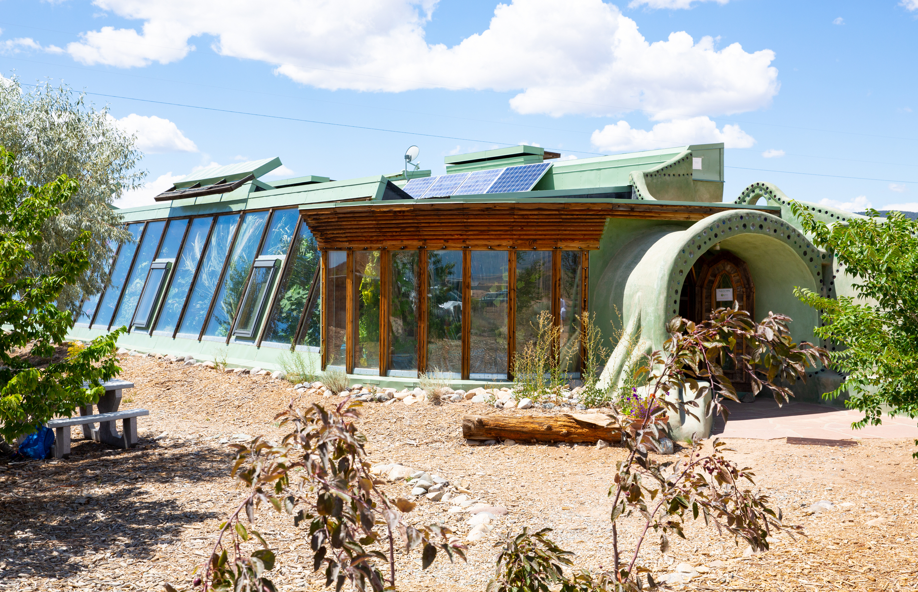 <p class="p1"><span>These off-the-grid sustainable homes, made from natural and recycled materials (such as used tires, car batteries, and glass bottles), look somehow futuristic and primitive at the same time.</span><span> Designed </span><span>by architect Michael Reynolds, “<a href="https://taos.org/places/earthship-biotecture/" rel="noreferrer noopener"><span>Earthships</span></a>” are located on a beautiful mesa just outside of Taos.</span></p>