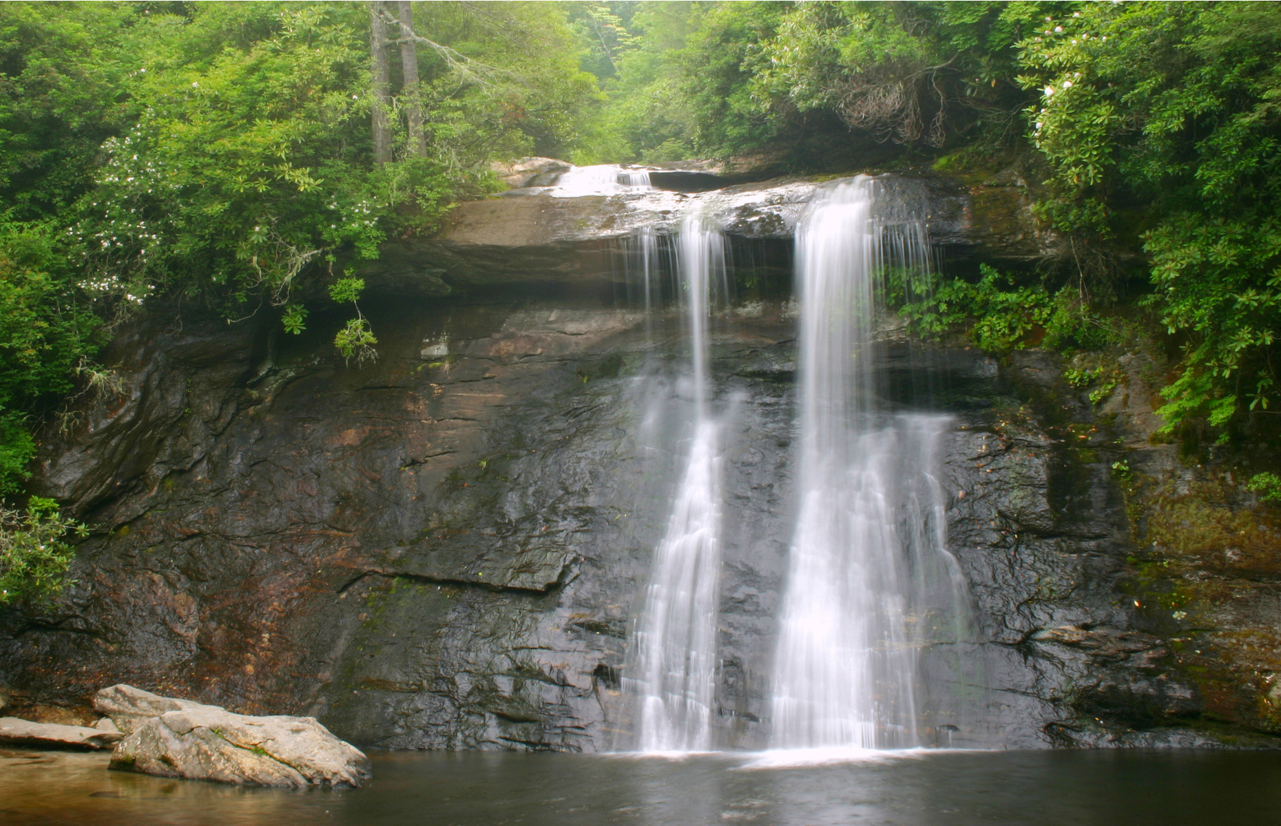 <p class="p1"><span>The name’s a bit of a misnomer since you should have no problem reaching it via a quick hike, and by now it’s hardly a secret to the locals, but <a href="https://www.romanticasheville.com/secret-falls.htm" rel="noreferrer noopener"><span>Secret Falls</span></a> still remains one of the most underrated natural sites in North Carolina. With a sandy beach and clear waters, it’s the perfect spot to cool off on a steamy summer day. </span></p>