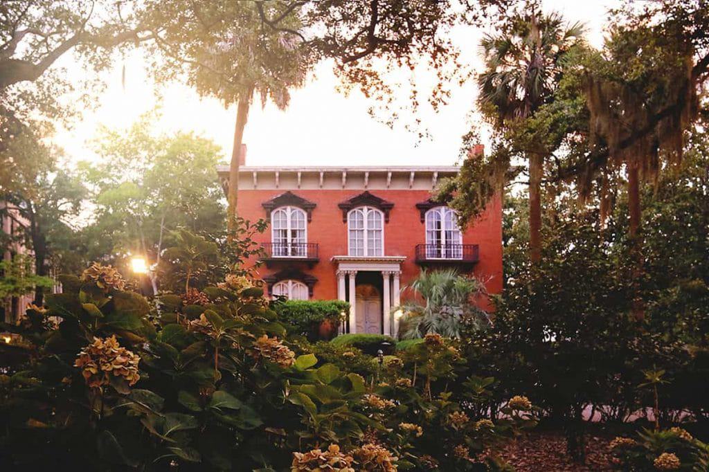 <p class="has-text-align-left"><em>Recommended by Erin of SavannahFirstTimer.com</em></p> <p>The always-intriguing Mercer Williams house has been drawing visitors to Savannah for decades – ever since John Berendt published his best-selling novel, "Midnight in the Garden of Good and Evil" in 1994.</p> <p>The book focuses on the life of local philanthropist and restoration expert Jim Williams, who was accused of shooting a young prostitute named Danny Hansford. The shooting took place during Williams' popular annual Christmas gala, and many of Savannah's elite were gathered at the home at the time.</p> <p>Hansford and Williams’ relationship had been a tumultuous one, and Williams claimed the shooting was in self-defense. He was tried four times in the state of Georgia before finally being acquitted on the charge of murder. Less than a year after his return to the <a href="https://savannahfirsttimer.com/mercer-williams-house/" rel="noopener">Mer</a><a href="https://savannahfirsttimer.com/mercer-williams-house/" rel="noopener">cer Williams House</a>, Williams' body was found in the study — ironically in almost the exact same location where Hansford was originally shot.</p> <p>The home is no stranger to tragedy. It sat empty and abandoned for a while and fell into a state of neglect. During that time, a young boy named Tommy Downs snuck into the house and stumbled to his death from one of the upper levels (some say he was pushed). Visitors can still see the missing spike where he was impaled on the beautifully wrought iron fence below.</p> <p>These days, members of Williams’ family still reside in the home, which has been impeccably restored. They allow visitors to tour a few rooms on the ground floor of the beautiful home. </p>