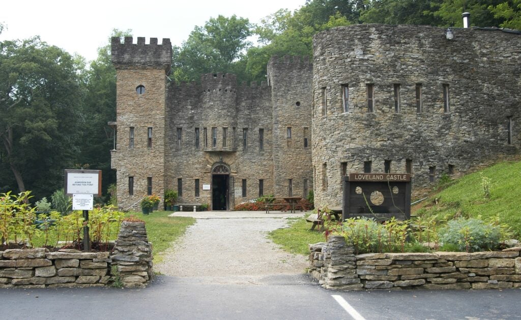 <p>Loveland Castle, aka Château Laroche, is built in the style of a Medieval castle on the banks of the Little Miami River. It was built by Harry Delos Andrews, who served in the military during World War I and was prematurely declared dead from meningitis. He recovered, but not before his fiancée , presuming her beloved dead, had married another man. He took life in stride and took a grand castle tour throughout Europe. He returned to the United States and built a castle that resembled castles he visited in France. It's open to visitors as a museum, wedding venue, and Boy Scout camping destination.</p>