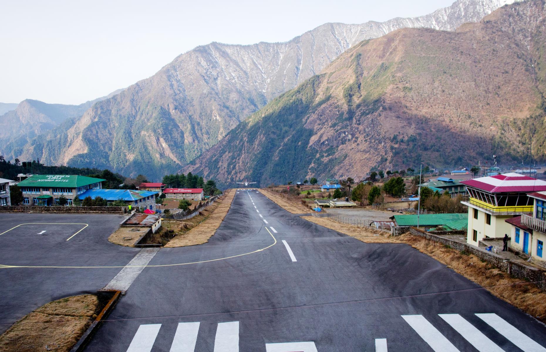 <p>Known as the gateway to Mount Everest, this tiny airport in Nepal is one of the best in the world for its dramatic views on landing and take-off. Its terrifyingly small 1,729-foot (527m) runway is perched on a cliff, with a 2,000-foot (609m) drop to the bottom.</p>