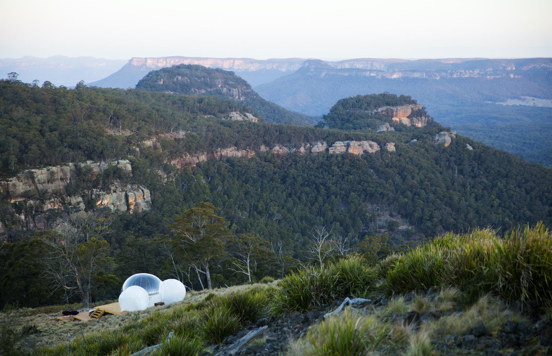 <p>Where exactly <a href="https://bubbletentaustralia.com/">Bubble Tent Australia</a> is located is kept top secret until bookings are made. All we know is that the three bubbles are somewhere between Mudgee and Lithgow overlooking Capertee Valley, hidden away from each other and the world. With firepits, floating day beds and wood-fired tubs, every detail has been accounted for. By day, it’s all about bird spotting, but it's at night when the tents come into their own. Designed with stargazing in mind, guests are given telescopes and iPads with astronomy apps. </p>