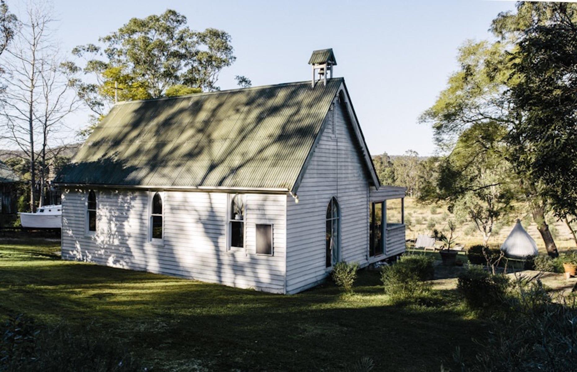 <p>A pretty 19th-century Anglican church on the banks of the Colo River in the Hawkesbury region has been thoughtfully converted into a super-cute, light-filled two-bed vacation cottage. <a href="https://www.airbnb.com.au/rooms/26583319">Available for bookings on Airbnb</a>, the little timber structure, which was consecrated in the 1880s, has a lovely terrace for peaceful contemplation. Inside many of the church's original features remain, including signs and wooden church pews that are now dining benches.</p>  <p><strong><a href="https://www.loveexploring.com/gallerylist/91142/australias-most-eerie-abandoned-buildings">These are Australia's most eerie abandoned buildings</a></strong></p>