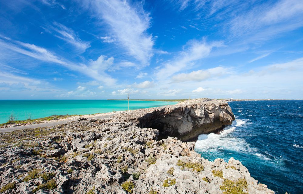 <p><strong>Location:</strong> Eleuthera</p> <p>Travel along Queen's Highway to snag one of the coolest views in the Bahamas. <a href="https://www.tripadvisor.com/Attraction_Review-g147428-d185166-Reviews-Glass_Window-Eleuthera_Out_Islands_Bahamas.html" rel="noopener noreferrer">Glass Window Bridge</a> consists of a strip of land and road that connects Eleuthera's Gregory Town and Lower Bogue, with stunning views of turquoise water on one side and deep sapphire water on the other. At its narrowest point, the bridge measures just 30 feet wide.</p> <p><strong>Pro tip:</strong> You'll hear people say this is where the Caribbean Sea meets the Atlantic Ocean, but the color change is the drop-off between the shallow bay and the deep ocean water.</p> <p class="listicle-page__cta-button-shop"><a class="shop-btn" href="https://www.tripadvisor.com/Attraction_Review-g147428-d185166-Reviews-Glass_Window-Eleuthera_Out_Islands_Bahamas.html">Learn More</a></p>