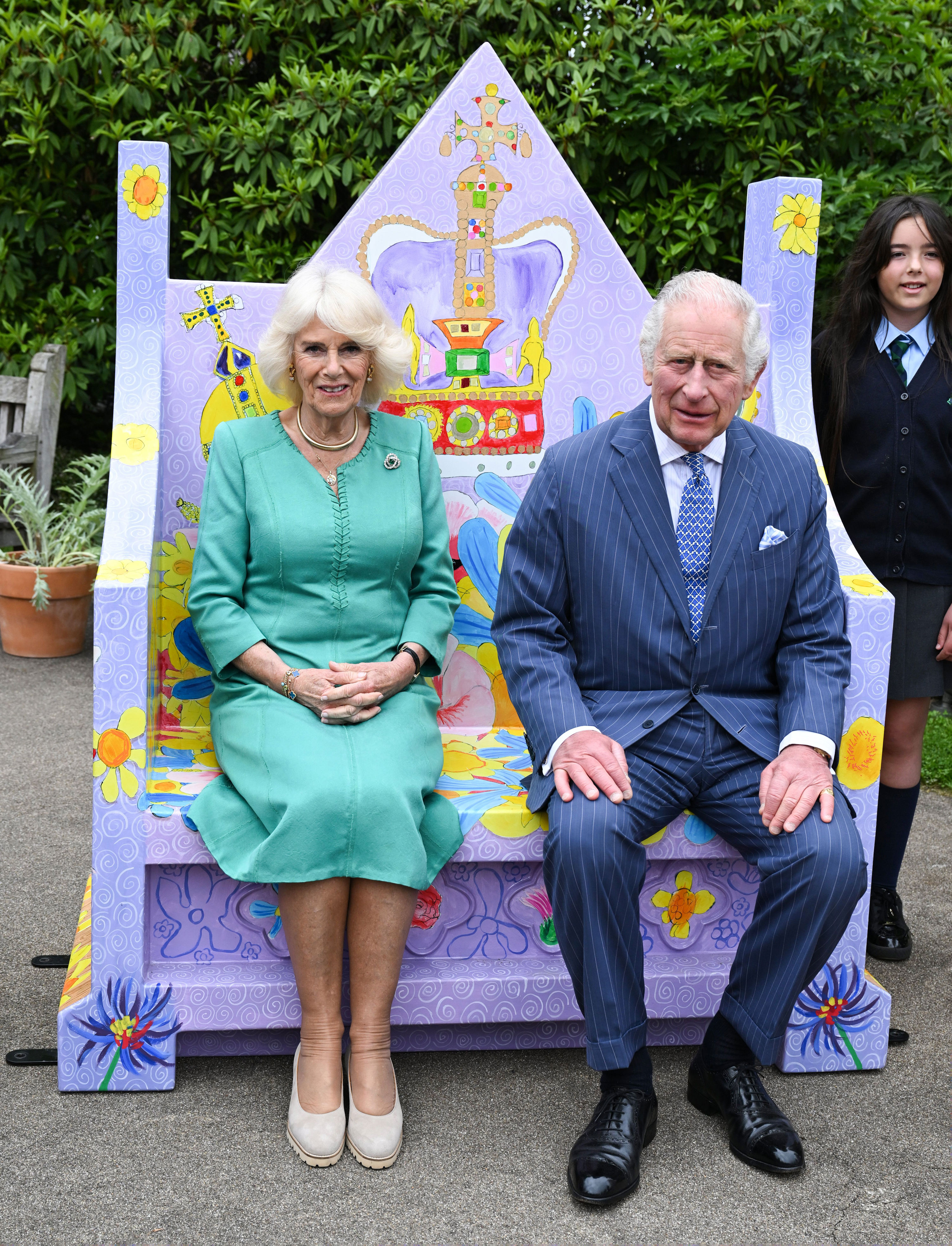 <p>King Charles III and Queen Camilla sat on a coronation bench during a visit to Hillsborough Castle -- their official royal residence in Northern Ireland -- on day one of their two-day visit to the British nation on May 24, 2023. There, they met pupils from a local primary school who took part in a Historic Royal Palaces competition to design coronation benches.</p>
