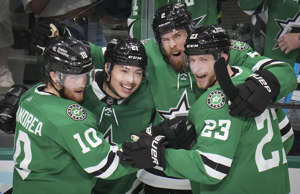Dallas Stars left wing Jason Robertson (21) celebrates with center Ty Dellandrea (10), defenseman Jani Hakanpää (2) and defenseman Esa Lindell (23) after scoring his second goal of the game to tie the score at 2-2 during the second period in Game 4 of the Stanley Cup Western Conference finals against the Vegas Golden Knights at the American Airlines Center on Thursday, May 25, 2023, in Dallas.