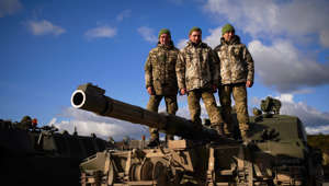 Ukrainian soldiers who are undergoing training at Bovington Camp, a British Army military base, pose on top of a FV 4034 Challenger 2 tank, during a visit by Defence Secretary Ben Wallace (unseen), southwest England, on February 22, 2023.
