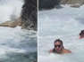 Una pareja es sorprendida por una enorme ola en una piscina natural