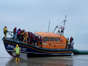 People thought to be migrants are brought in to Dungeness, Kent, by the RNLI following a small boat incident in the Channel