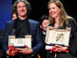 Jonathan Glazer and Justine Triet pose with their awards - Getty