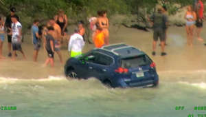 Woman arrested after driving down beach in US