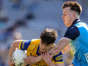 Roscommon's Ben O’Carroll is tackled by Daire Newcombe of Dublin