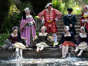 Cast members of I'm Henry 8-0 Degrees I am I am: Past-Times Living History Tudor cool down in the garden pond at Berkeley Castle