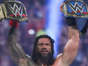 Roman Reigns Holding Up Titles