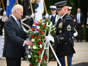 President Joe Biden participates in a wreath-laying ceremony at the Tomb of the Unknown Soldier at Arlington National Cemetery.