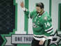 Dallas Stars left wing Jamie Benn (14) waves during a ceremony honoring his 1000th NHL game before an NHL hockey game against the Colorado Avalanche at the American Airlines Center on Saturday, March 4, 2023, in Dallas.