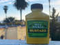 A bottle of Trader Joe's dill pickle mustard outside