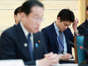 Shotaro Kishida, right, son of Japanese prime minister Fumio Kishida, left, at a May 15 meeting.