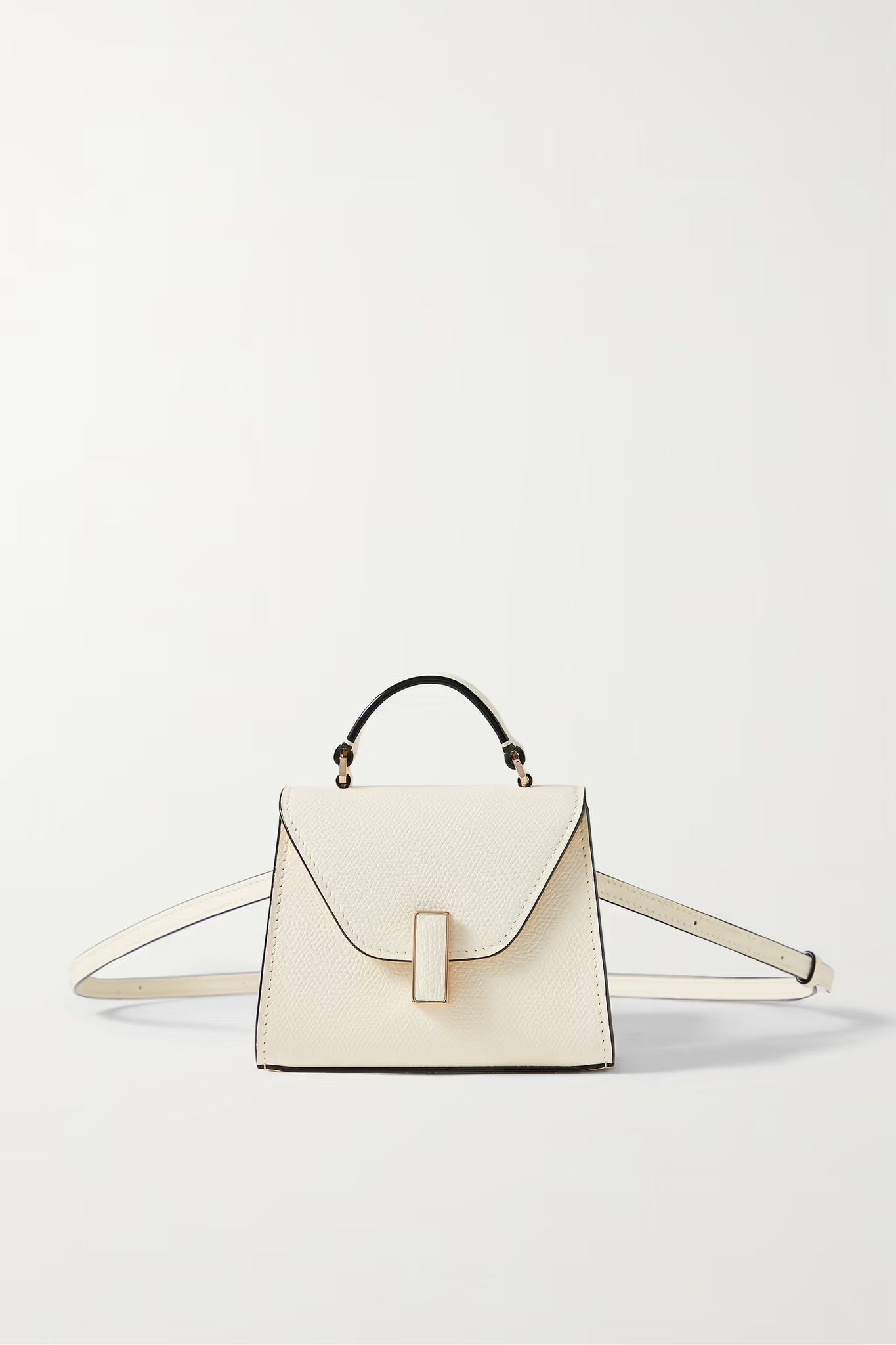 <p><strong>$1350.00</strong></p><p>This style is two-in-one. A mini top-handle bag is laced through a thin belt, for a stylish approach to the micro bag trend. Store your credit cards, keys and little necessities in this stylish option in bold cream. Belt it over a ruched, body con dress for a night out or a boyfriend blazer for a daytime approach. </p><p><strong>Size:</strong> 2.4 "D x 3.9 "H x 4.7 "W. Min. Strap Length: 24.8"; Max. Strap Length: 46.9"; Handle Drop: 1.2". </p><p><strong>Material: </strong>Cow Leather </p><p><strong>Colors: </strong>Cream </p>