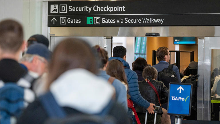 Travelers go through security at San Francisco International Airport (SFO) in San Francisco, California, US, on Thursday, May 25, 2023. David Paul Morris/Bloomberg via Getty Images