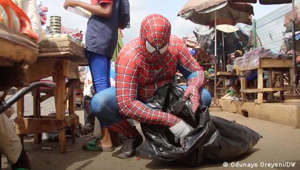 Nigerian activist Jonathan Olanlokun is on a mission to tidy up the environment. He wears a Spiderman costume to highlight the issue of trash on the streets.