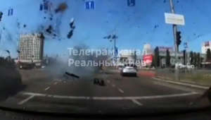 Dash cam video shows missile debris almost hitting Kyiv bus