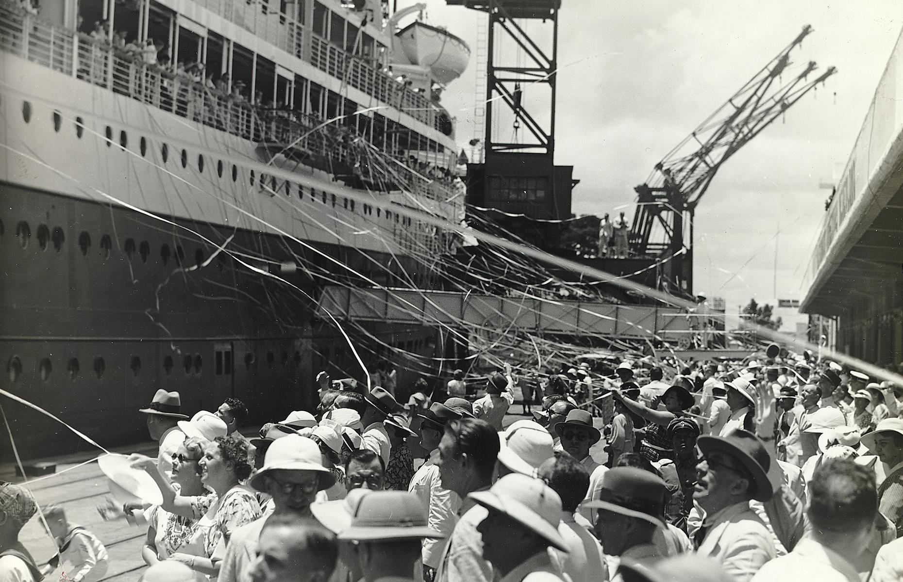 The Second World War was another blow to commercial cruising: yet again, liners were repurposed as war vessels and pleasure cruising came to an abrupt halt. By the end of the decade, though, surviving ships were returned to their lines and put back into service. Slowly but surely, the appetite for cruising grew again. Here an excited crowd welcomes a ship at a Java seaport in the 1940s.