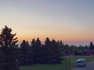 A hazy sunset ends the day in Red Deer