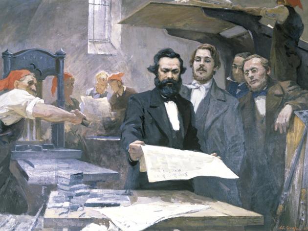 Karl Marx und Friedrich Engels mit einer Ausgabe der Neuen Rheinischen Zeitung.