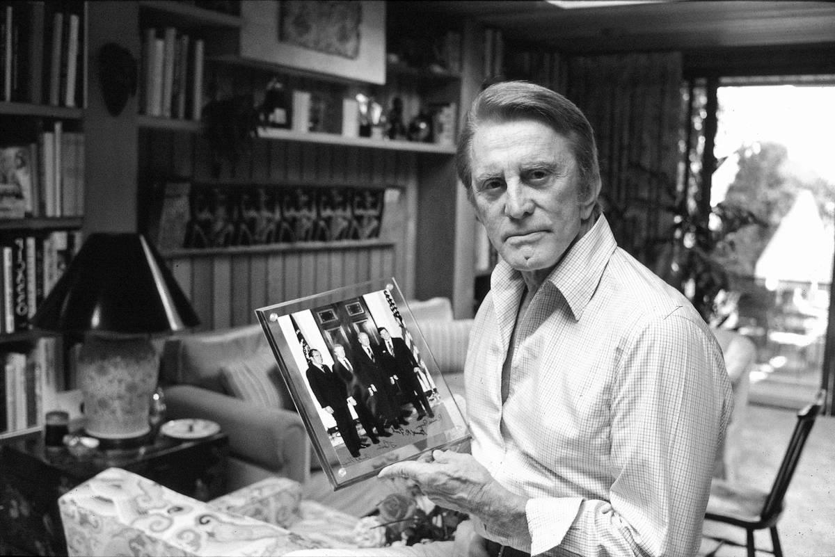 <p>Kirk Douglas was well known for his affinity for unique artwork and one-of-a-kind pieces. His home was decorated with at least two different Pablo Picasso pieces, which were just a small part of his curated collection. </p> <p>Pictured here in his home office, Douglas posed with a photo of four former U.S. presidents. The photo is signed by each of the presidents. </p>
