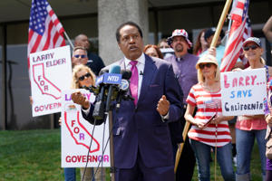 Larry Elder, who has emerged as the Republican frontunner in  latest polling and fundraising for the Sept. 14 recall election of California Gov. Gavin Newsom, rallies with supporters on July 13 in Norwalk.