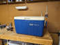 My Coleman cooler, which I got for free off of someone's tree lawn, sitting on my workbench at home.