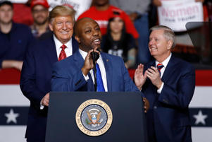 Sen. Tim Scott, R-S.C., speaks in front of President Donald Trump and Sen. Lindsey Graham, R-S.C., during a campaign rally, Friday, Feb. 28, 2020, in North Charleston, S.C. When Scott launched his campaign for the White House last week, the notoriously prickly former President Donald Trump welcomed his new competitor with open arms. &#x201C;Good luck to Senator Tim Scott in entering the Republican Presidential Primary Race,&#x201D; Trump said.