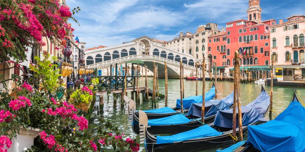 <p><em>Recommended by Angela of <a href="https://whereangiewanders.com/" rel="noreferrer noopener">Where Angie Wanders</a></em></p> <p>Venice is a must-visit destination in northern Italy; once you have experienced its history and beauty, you will want to return time and time again. Italy's floating city is the only place in the world that is fully pedestrianized, and the only traffic jams you will find here are caused by boats.</p> <p><a href="https://whereangiewanders.com/3-nights-in-venice-itinerary/" rel="noreferrer noopener">Getting around Venice</a> by water can seem complicated on a first visit; however, with waterbuses, water taxis, and gondolas, you can be sure to get around the city easily and quickly. Arriving in the city center from the airport by water taxi is a fantastic experience reminiscent of a James Bond movie! Looking for somewhere to stay? Click here for <a href="https://routinelynomadic.com/where-to-stay-in-venice-neighbourhoods/" rel="noreferrer noopener">places to stay while in Venice</a>.</p> <p>St. Mark's Square is the main tourist area in Venice, and visitors arrive to admire the centuries-old Venetian/Roman architecture of St. Mark's Basilica. It is in the square you will also find the Bell Tower and Doges Palace. This area is always busy but walks away from it, and within 10 minutes, you will find yourself in quiet backstreets where you can wander freely without the crowds.</p> <p>Finding good Italian cuisine should definitely be on your <a href="https://paigemindsthegap.com/2-days-in-venice-italy-travel-itinerary/" rel="noreferrer noopener">Venice itinerary</a>. Don't buy food and drink in St. Mark's Square – the prices are extortionate – instead, find one of the numerous cafes that sell cicchetti. This is the traditional food of Venice – similar to tapas – and can be accompanied by local wine. It is a cheap and tasty way of eating in Venice, with dishes usually costing no more than €2 each. Here’s a </p> <p>If you have time, make a day trip from Venice to Burano, the Italian island famous for its incredible rainbow-colored houses, freshly caught fish, and lace-making. </p>