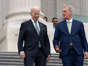 President Joe Biden walks with House Speaker Kevin McCarthy, R-Calif., as he departs the Capitol following the annual St. Patrick's Day gathering, in Washington, Friday, March 17, 2023. Facing the risk of a government default as soon as June 1, President Joe Biden invited the top four congressional leaders to a White House meeting for talks.