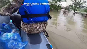 Watch: Bosnia rescuers bring aid to stranded flood victims