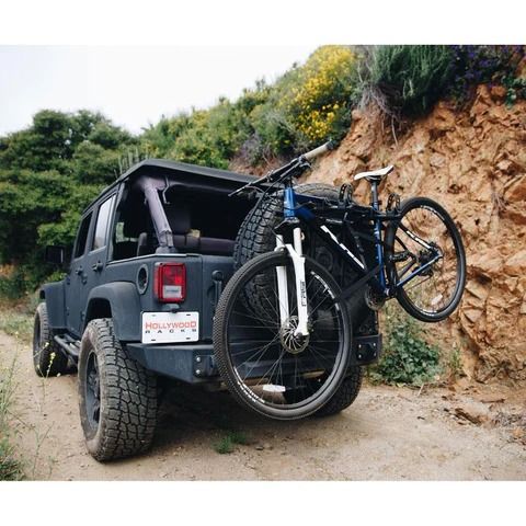 <p>An excellent option for sport-utility or off-road vehicles, spare-tire bike racks are ideal for Jeeps—or any vehicle with an externally mounted spare. Similar to a trunk-mounted rack, they attach via straps to the tire mount or rest directly on the tire.</p>